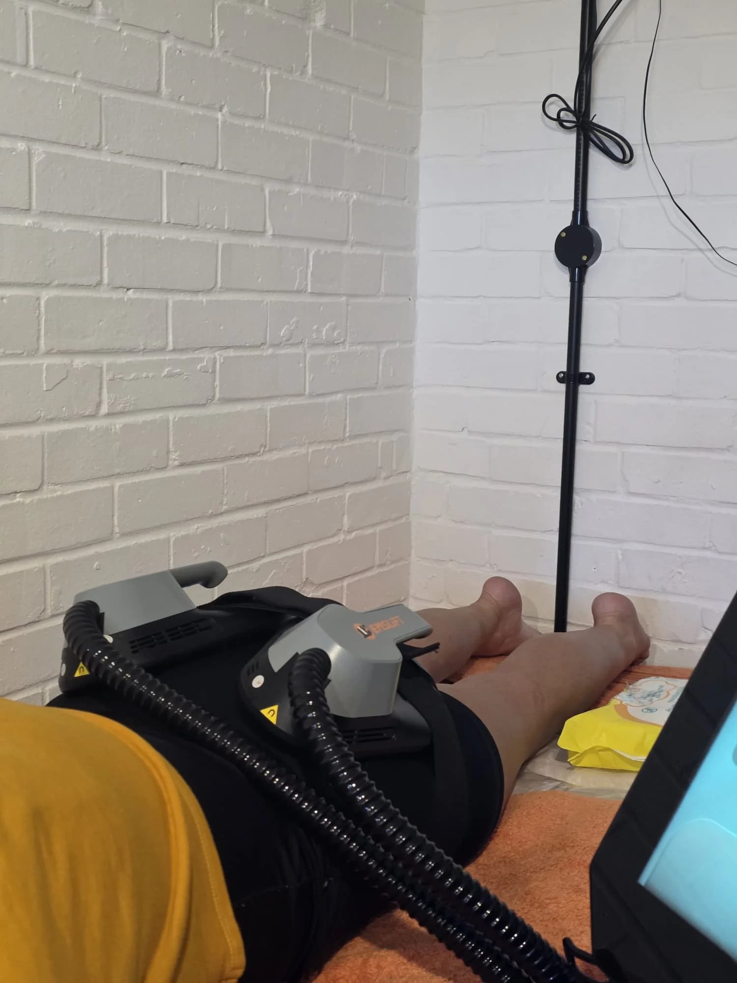 EMS Sculpting treatment in progress